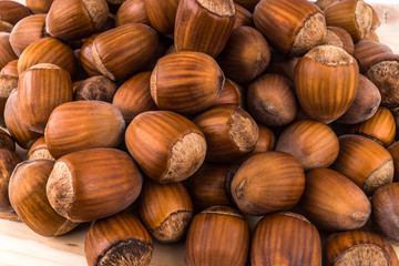hazelnuts on wooden background