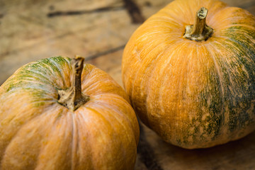 pumpkins on a wooden background