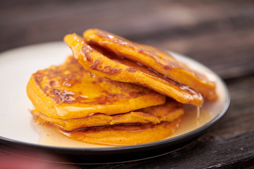 pancake with honey on wooden background