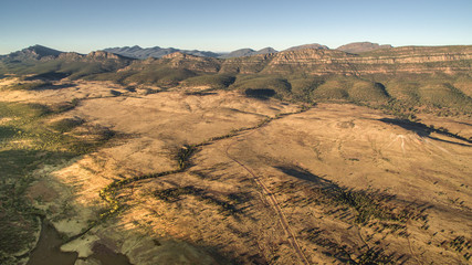 Fototapeta na wymiar Aerial landscape view in the late afternoon of the Southern Escarpment of Wilpena Pound in the Flinders Ranges, South Australia.