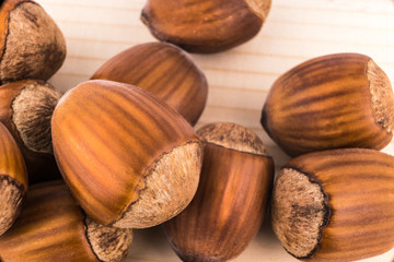 hazelnuts on wooden background