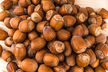 hazelnuts on wooden background