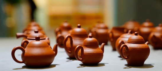 red enameled pottery teapot