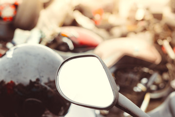 the mirror on the handlebars of the motorcycle
