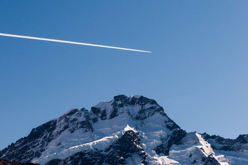 Plane flying over mountain