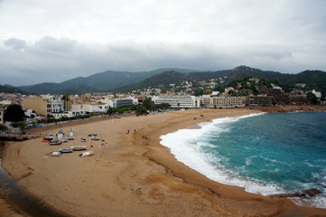 Spain.Costa Brava.The central beach of Tossa de Mar in bad weather.