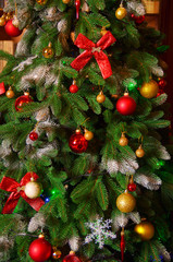 Fototapeta na wymiar Christmas tree decorated with garlands, close-up.