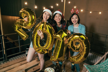 Fototapeta na wymiar asian ladies ecited for coming up new year.