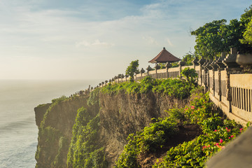 Pura Luhur Uluwatu temple, Bali, Indonesia. Amazing landscape - cliff with blue sky and sea