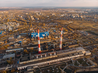 Aerial view of Power Plant or station with high chimneys near water reservoir