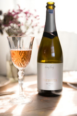 A bottle and glass of rose Champagne