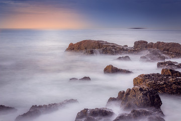 waves crashing on rocks