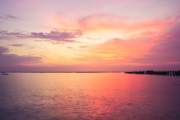 Fototapeta premium Beautiful panoramic view of ocean tranquil at sunset,Two boats are stationary.copy space For text.