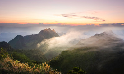 Beautiful landscape of Sunrise with mist, sky and cloud from top mountain in Sunrise at Thailand
