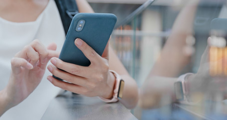 Close up of woman use of mobile phone in city