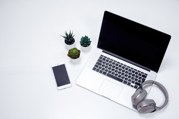 Laptop, Headphones, mobile phone on the table