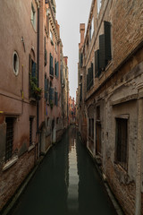 View on  tight canal in Venice with beautiful architecture