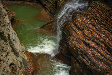 Fototapeta na wymiar Glen creek cascading over the rocks in Watkins glen state park