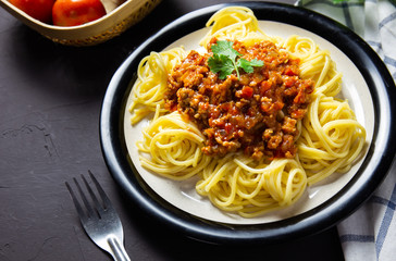delicious homemade plate of spaghetti on black board