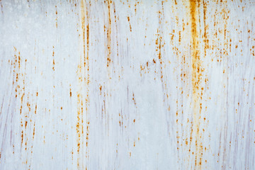 Rust on metal surfaces painted with white for design and advertising. There is space for copying of text input.