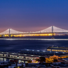 Fototapeta na wymiar Bay Bridge in San Francisco and city view at night
