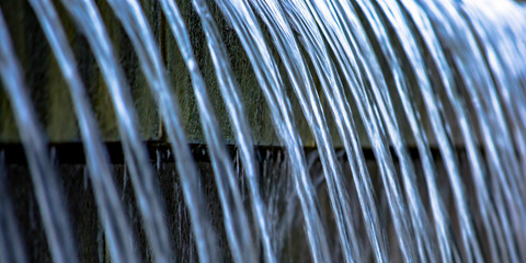 Clear water streaming from an outdoor fountain