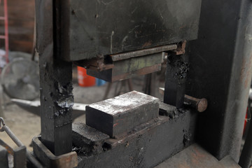 Hydraulic press in backsmith workshop