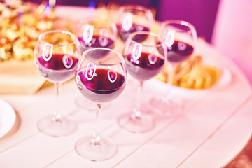 Red wine drinks in glasses on white background