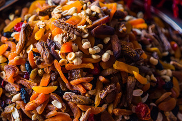 Dried fruit mix on the market. Colored dried fruit in the store. Juicy and sweet snack of nuts. Famous oriental traditional sweetness delight