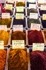 Many colorful spices are sold in the market. Eastern culture is a lot of spices in food. Spicy, sour and sweet spices. Turkish market. Indian market. Ingredients for cooking.