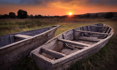 Colorful scenic sunrise with fishing boats in the foreground in Karema, Lake Tanganyika, Tanzania