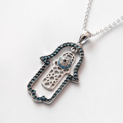 Hamsa pendant on the neck