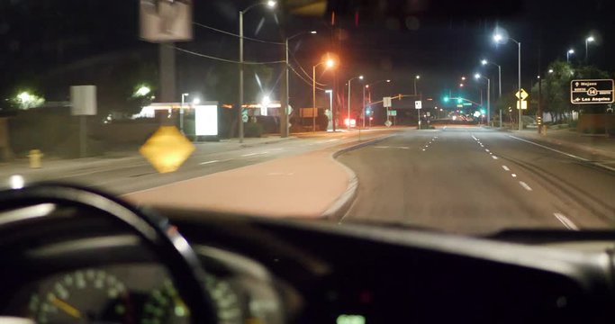 Looking out of the car windshield of a commuter driving to Los Angeles for work very early in the morning to miss traffic.