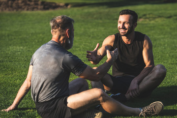 The two sportsmen handshaking on the grass