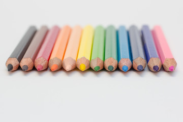 Naklejka premium group of colored pencils on gray background