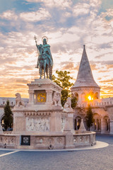 Fototapeta na wymiar BUDAPEST, HUNGARY - JUNE, 18: Fisherman's Bastion is an important landmark of Budapest. Monument of historical architecture. White towers and columns at the sunrise. Monument of the Istvan king