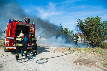 Firefighter extinguishes a fire