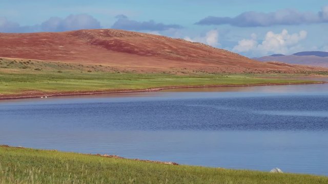 Panoramic video of mongolian lake Telmen Lake surrounded by hills and deserts in north Mongolia