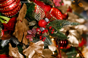 Christmas tree branch decorated with red berries
