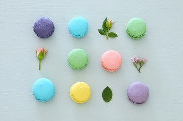 Top view of colorful macaron or macaroon over pastel blue background. Flat lay.