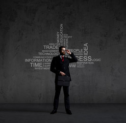 Businessman with briefcase standing over wall with text. Business, success, improvement, concept.  