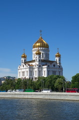 Fototapeta na wymiar Summer view of the Prechistenskaya embankment and the Cathedral of Christ the Saviour, Moscow, Russia
