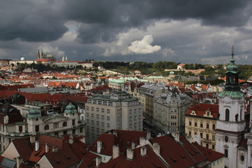 Obraz premium Cityscape of Prague with Prague Castle in the distance seen from the Clock Tower at Old Town Square.