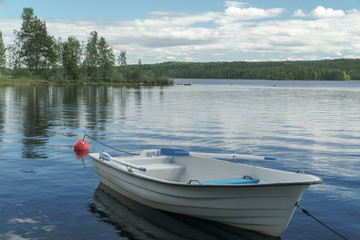 Row boat in small lake
