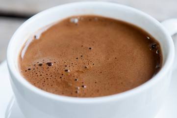 Top view of a cup of coffee isolated on white background