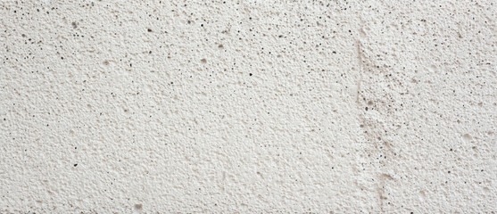 Close-up surface and rough white concrete pattern.