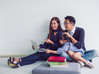 happy family with father mother and child in home