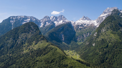 Aerial view of mountain range with snow in the alpine mountains