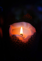 Beautiful macro photo of a small candle with a flame