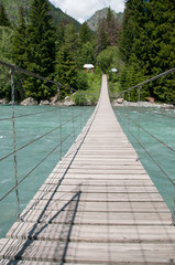 old wooden bridge over the mountain river